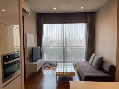 Modern living room with city view, featuring sleek furniture and large window for natural light.
