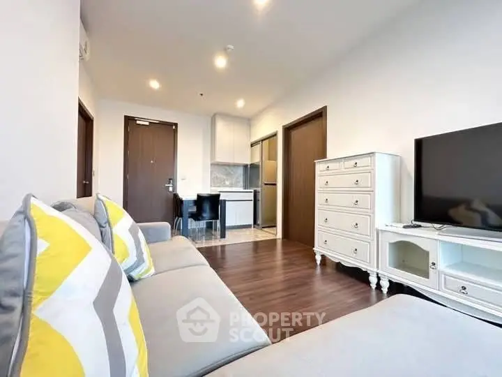 Modern living room with stylish furniture and open kitchen layout