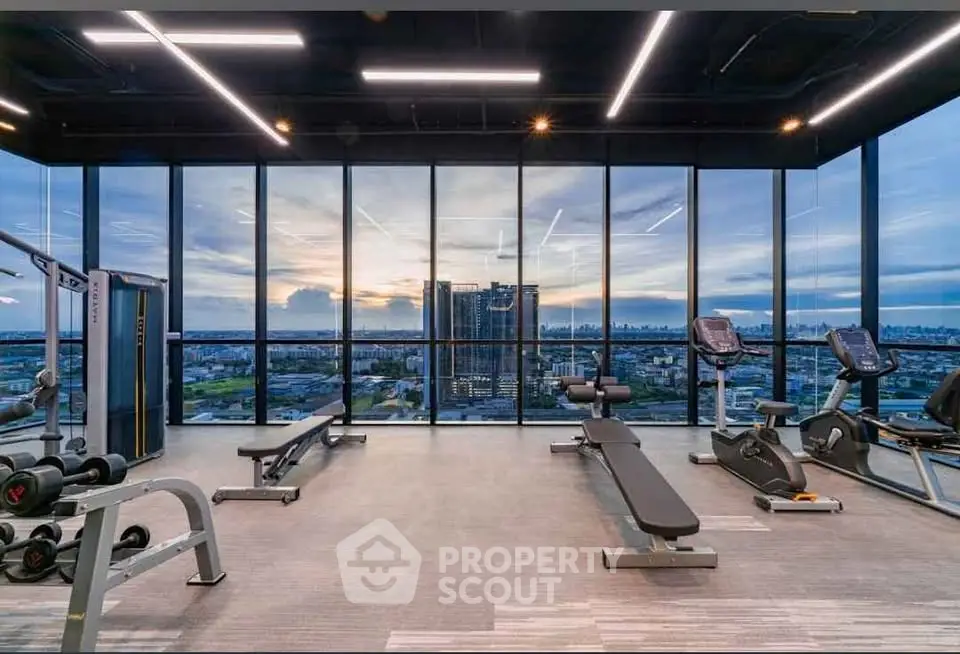 Luxury gym with panoramic city view and modern equipment