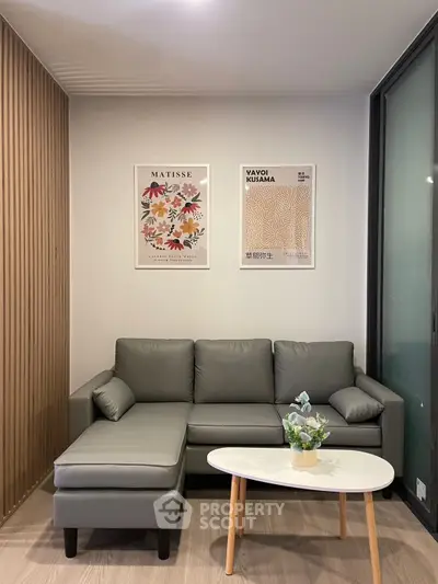 Modern living room with sleek gray sofa and stylish decor