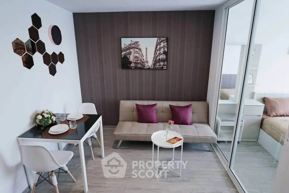Modern living room with stylish decor and cozy seating in a contemporary apartment.