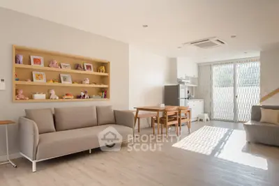 Spacious modern living room with natural light and stylish furniture