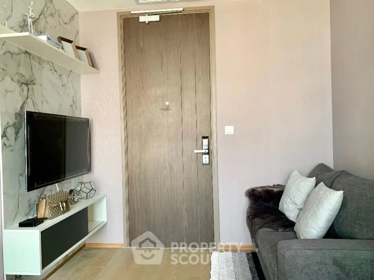 Cozy living room with modern decor and wall-mounted TV