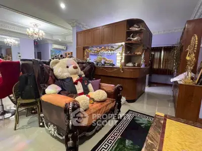 Luxurious living room with elegant decor and plush teddy bear on ornate sofa