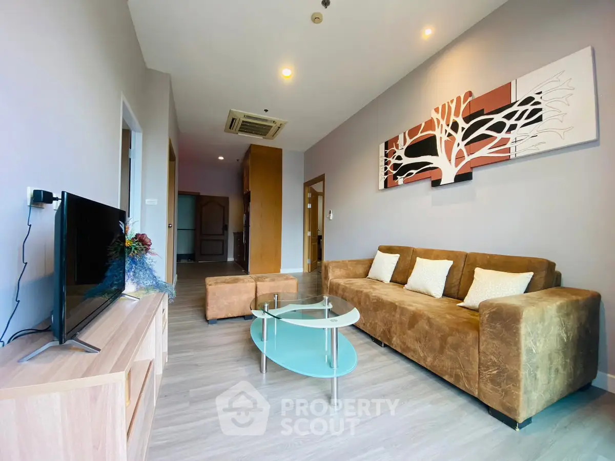 Modern living room with stylish decor and comfortable seating in a contemporary apartment.