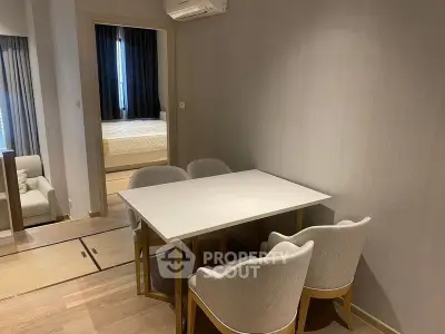 Modern dining area with elegant table and chairs in a stylish apartment