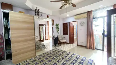 Spacious bedroom with balcony access and elegant decor