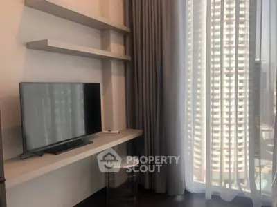 Modern living room with TV and city view through large window