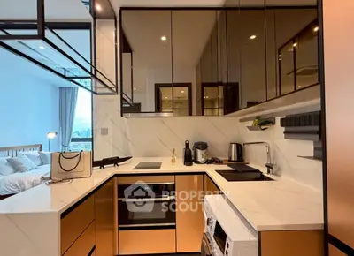 Modern kitchen with sleek cabinetry and integrated appliances in a stylish apartment