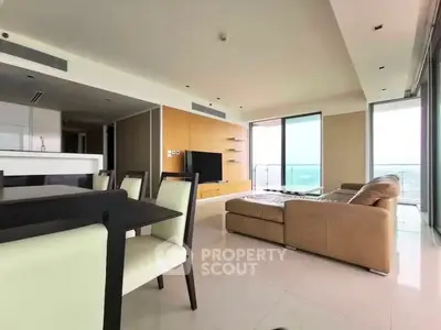 Spacious modern living room with panoramic windows and elegant furniture