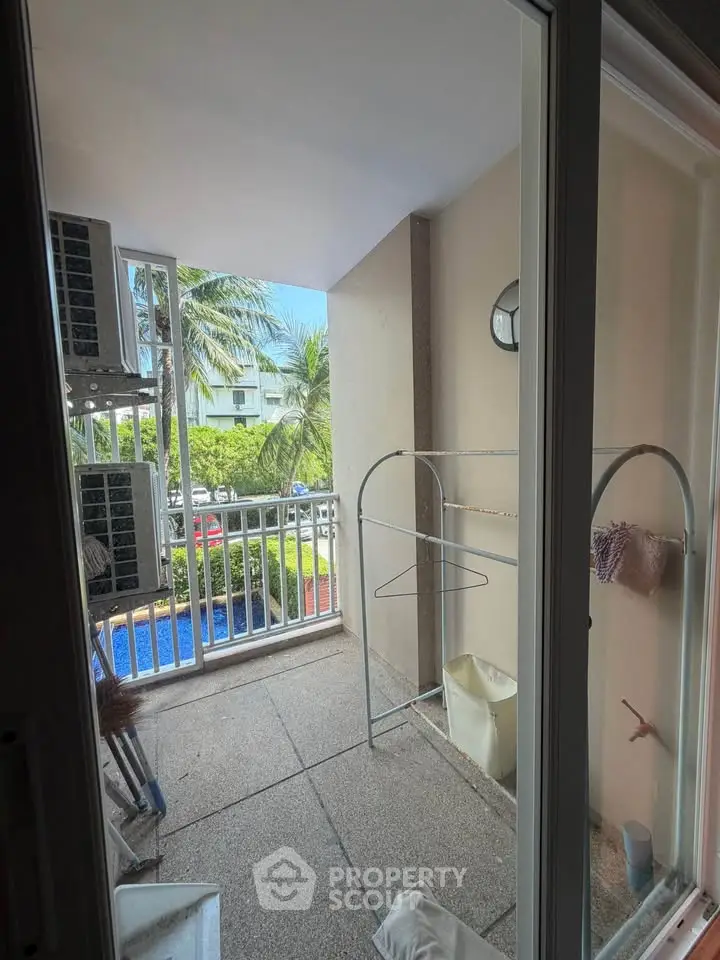 Charming balcony with pool view, perfect for relaxation and enjoying the outdoors.