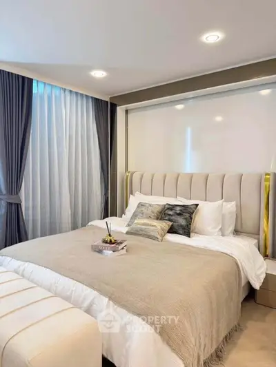 Luxurious bedroom with elegant decor and plush bedding