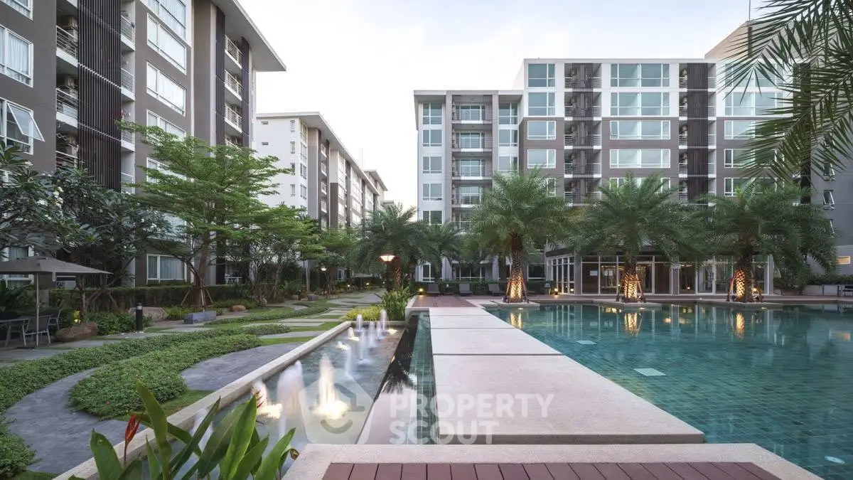 Luxurious condominium with stunning pool and lush garden view