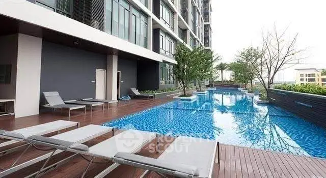 Luxurious condominium with stunning poolside view and modern amenities.