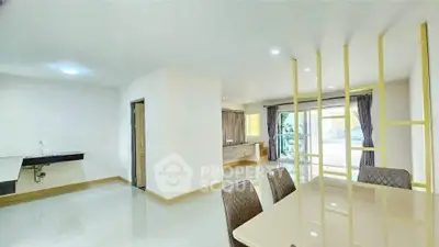 Spacious modern living area with dining table and open layout