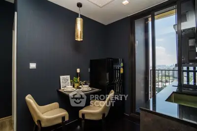 Modern kitchen with open layout and city view from balcony