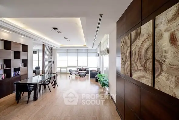 Spacious modern living room with elegant decor and ample natural light.