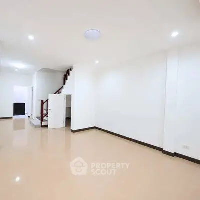 Spacious and bright interior with staircase and open layout, ideal for modern living.