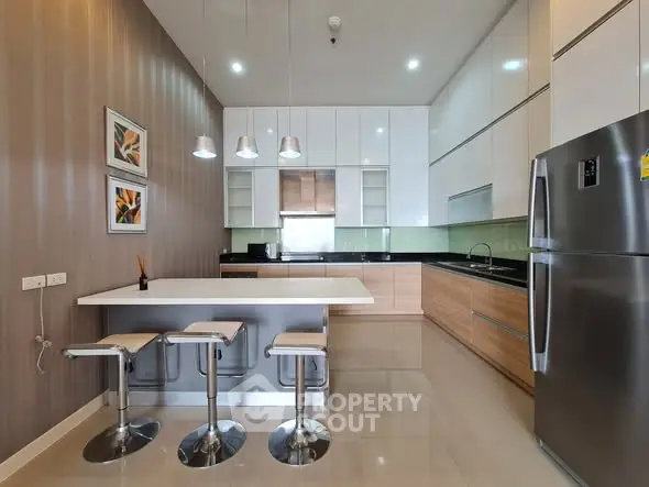 Modern kitchen with sleek cabinetry and stainless steel appliances