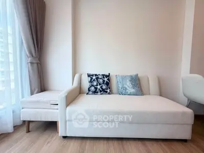 Modern living room with stylish sofa and natural light