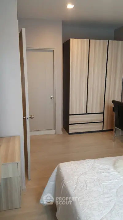 Modern bedroom with sleek wardrobe and minimalist design