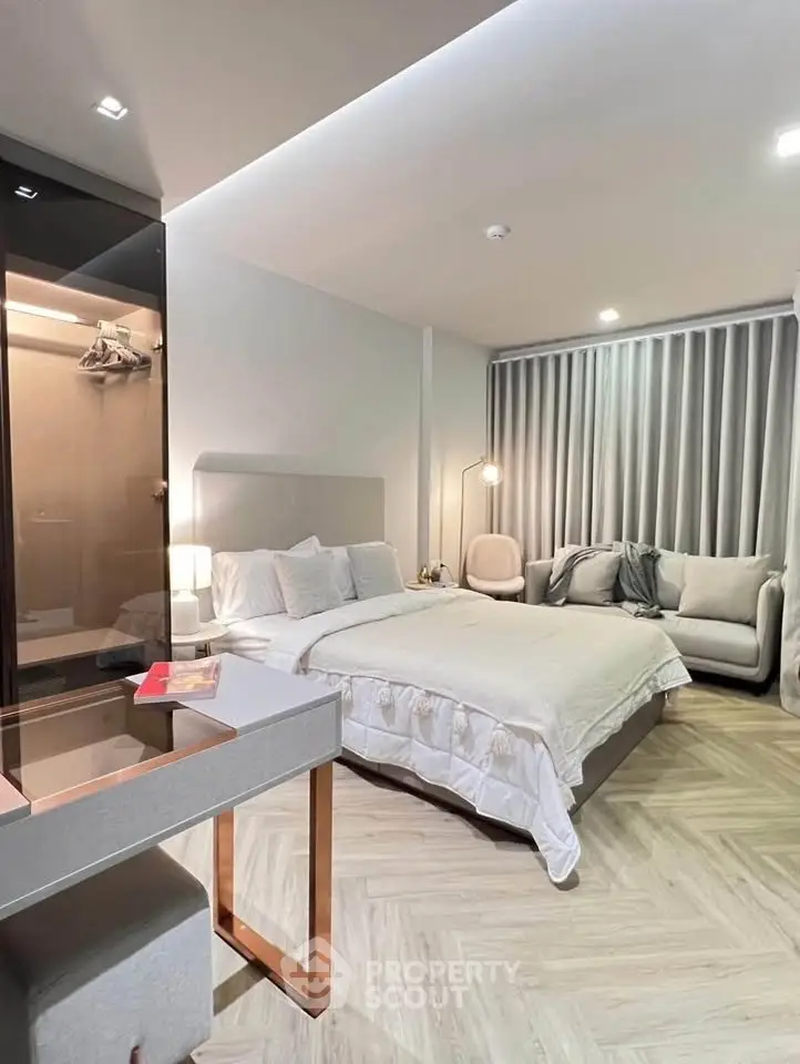 Luxurious modern bedroom with elegant decor and cozy ambiance, featuring a plush bed and stylish furniture.