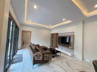 Modern living room with sleek design and large sliding glass doors