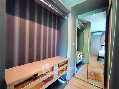 Spacious walk-in closet with modern design and ample storage space in a stylish apartment.