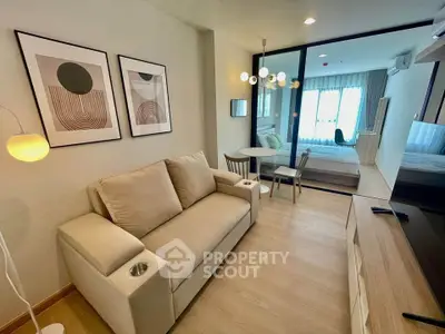 Modern living room with stylish decor and cozy seating in a contemporary apartment.