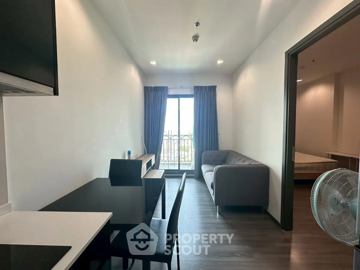 Modern apartment living room with balcony view and stylish furniture