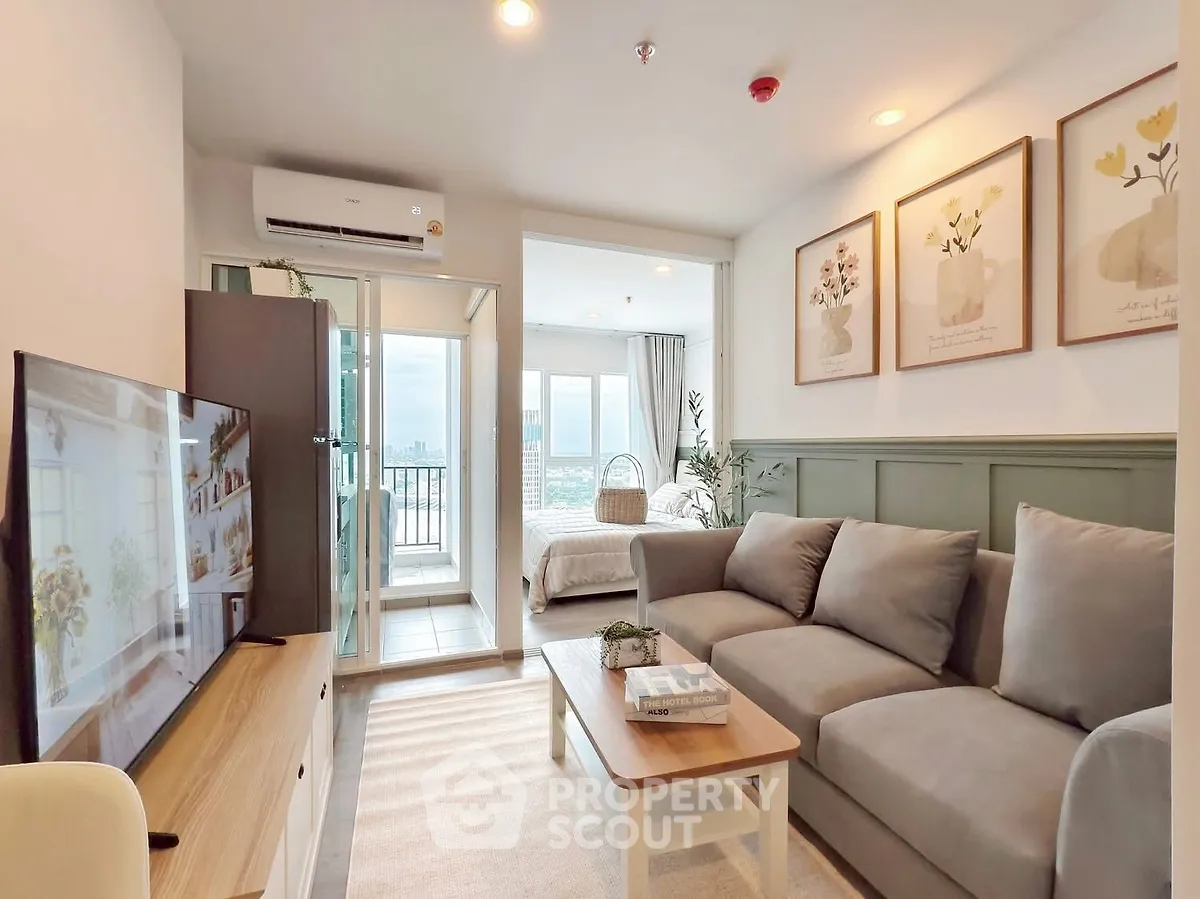 Modern living room with cozy sofa, TV, and balcony view in stylish apartment.