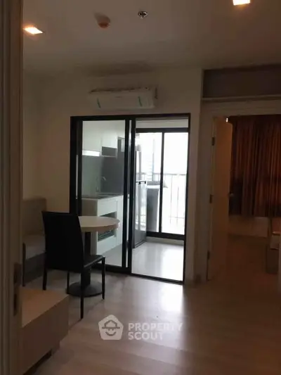 Modern apartment interior with open layout and balcony access