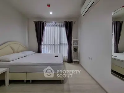 Modern bedroom with elegant decor, featuring a comfortable bed and stylish curtains, perfect for relaxation.