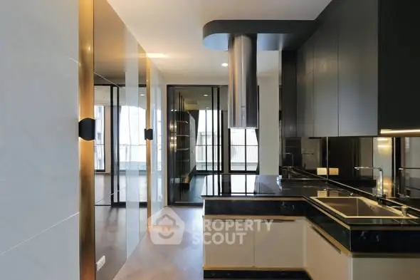 Luxurious modern kitchen with sleek black cabinetry and high-end appliances.