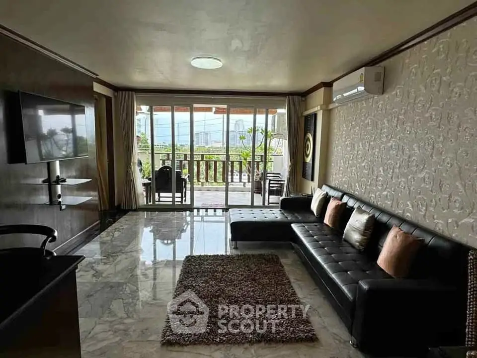 Spacious living room with modern decor and balcony view
