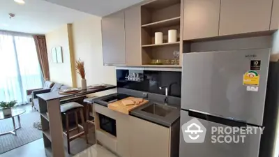 Modern kitchen with open layout and sleek appliances in stylish apartment