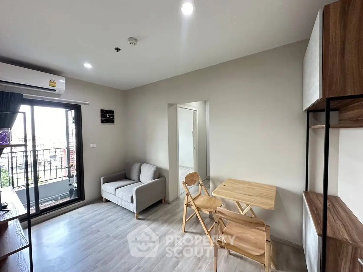 Modern living room with balcony access and stylish furniture