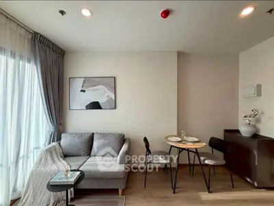 Modern living room with cozy sofa and dining area in stylish apartment