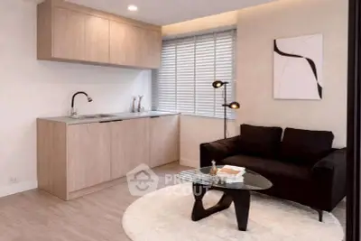 Modern living room with sleek kitchenette and stylish decor