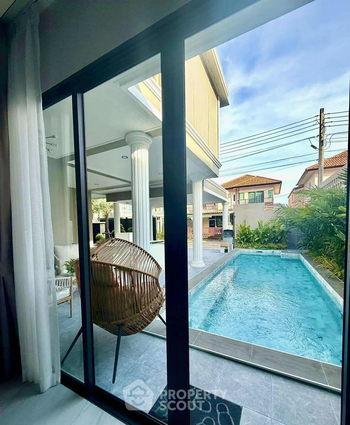 Luxurious home with private pool and elegant outdoor seating area