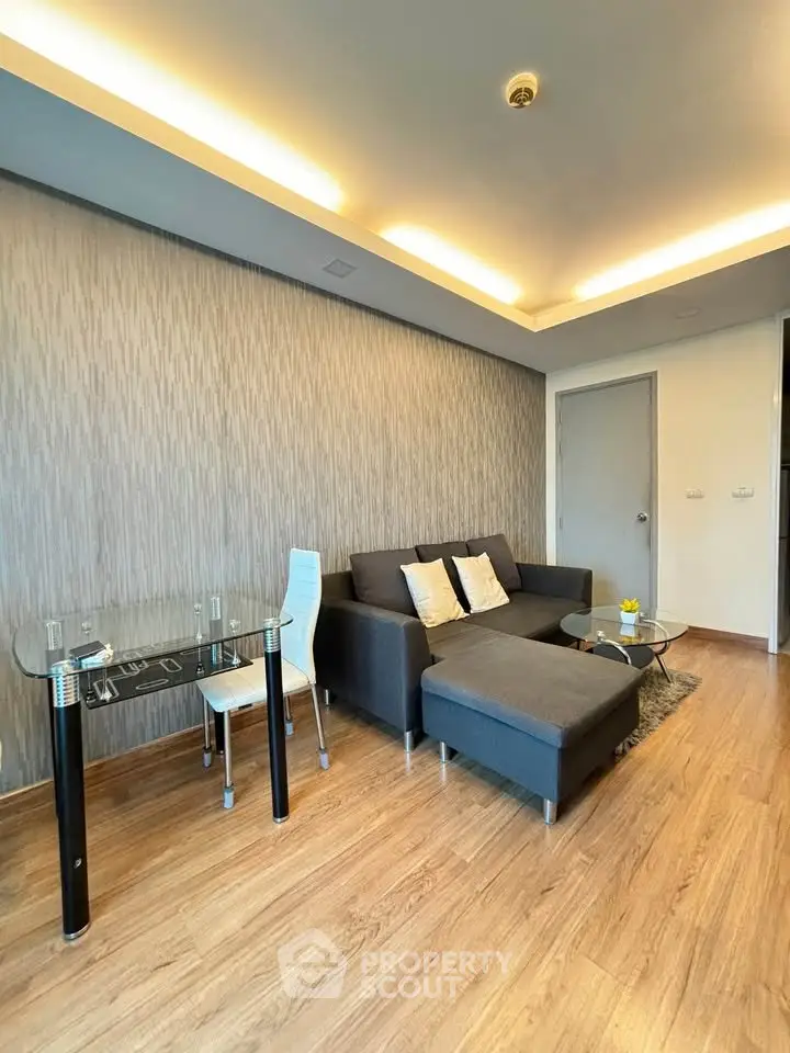 Modern living room with stylish furniture and elegant lighting in a contemporary apartment.
