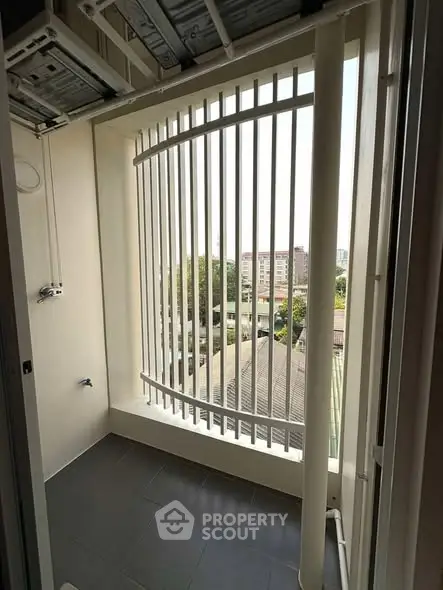 Spacious balcony with city view and modern railing design