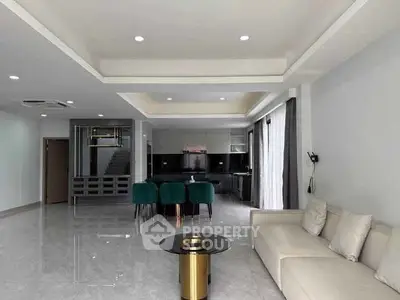Spacious modern living room with open kitchen and elegant decor