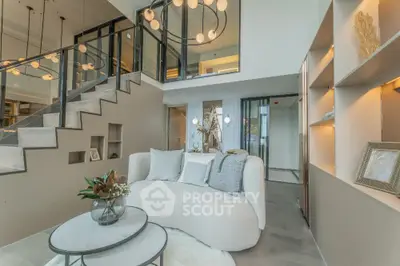 Luxurious modern living room with elegant staircase and stylish decor