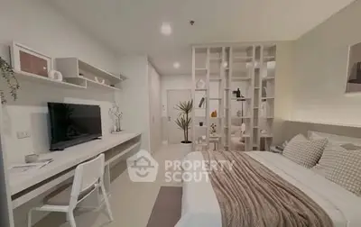Modern bedroom with stylish decor and built-in shelving, featuring a cozy bed and workspace.