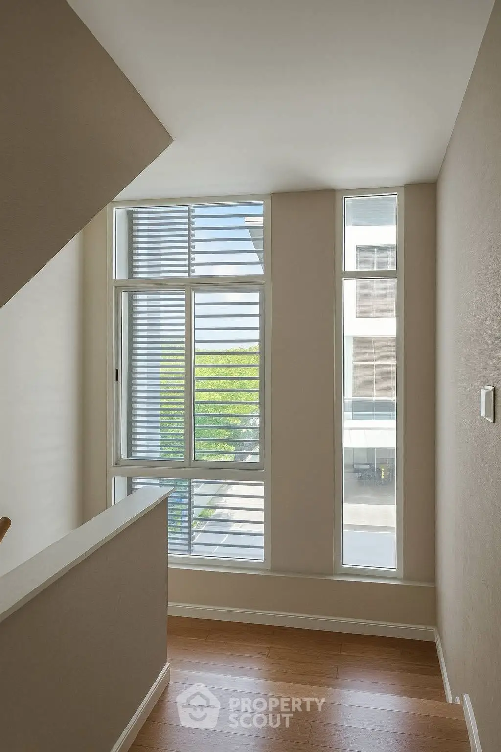 Bright hallway with large windows and modern design