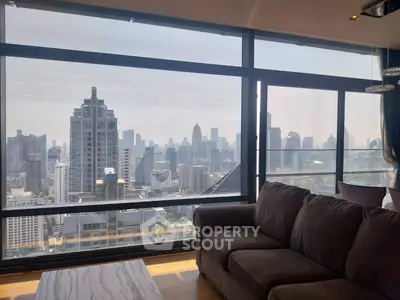 Stunning cityscape view from modern high-rise apartment living room