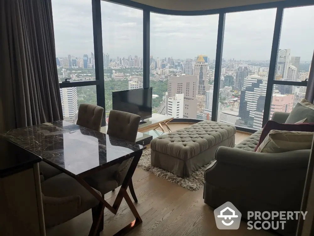 Luxurious high-rise living room with stunning city skyline view and elegant furnishings.