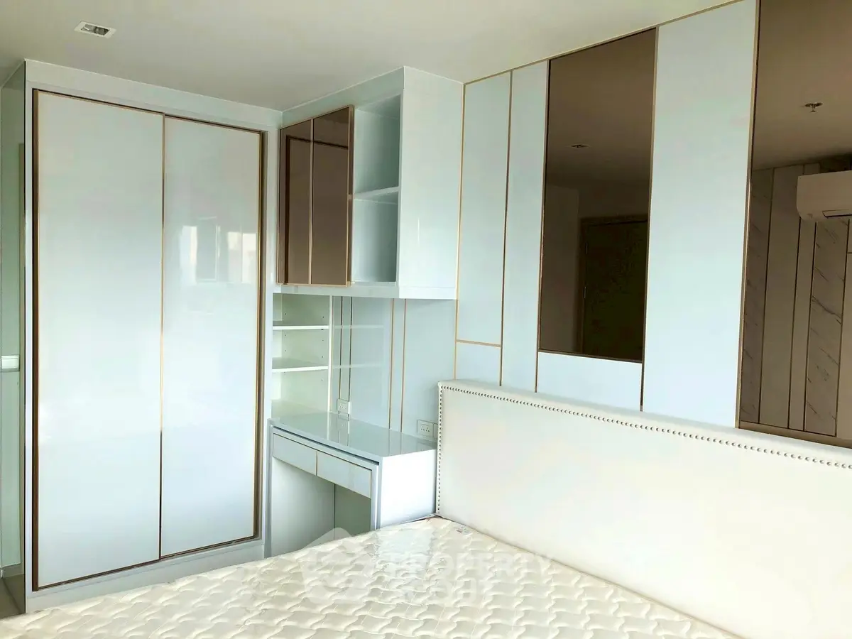 Modern bedroom with sleek built-in wardrobe and elegant design
