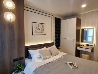 Modern bedroom with stylish decor, cozy lighting, and elegant furnishings.